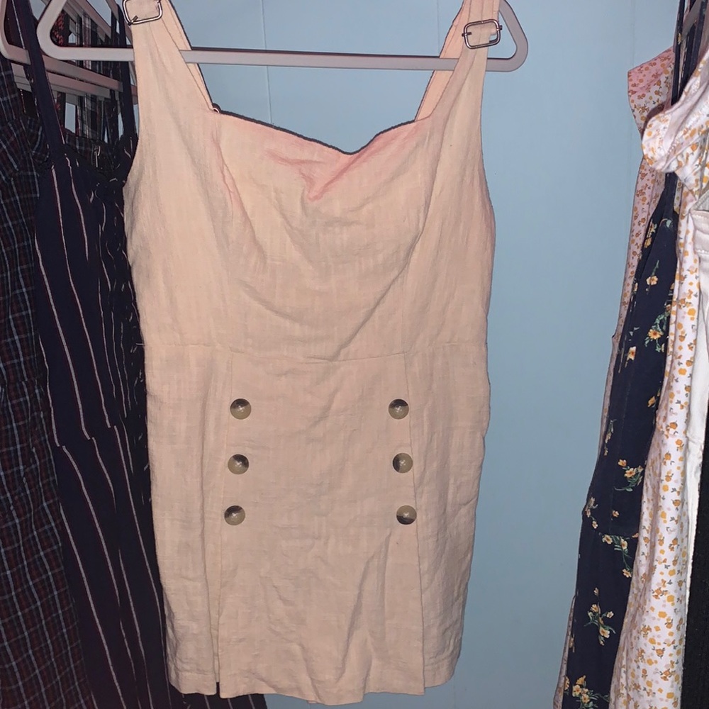 a tan romper that has adjustable straps *neverworn